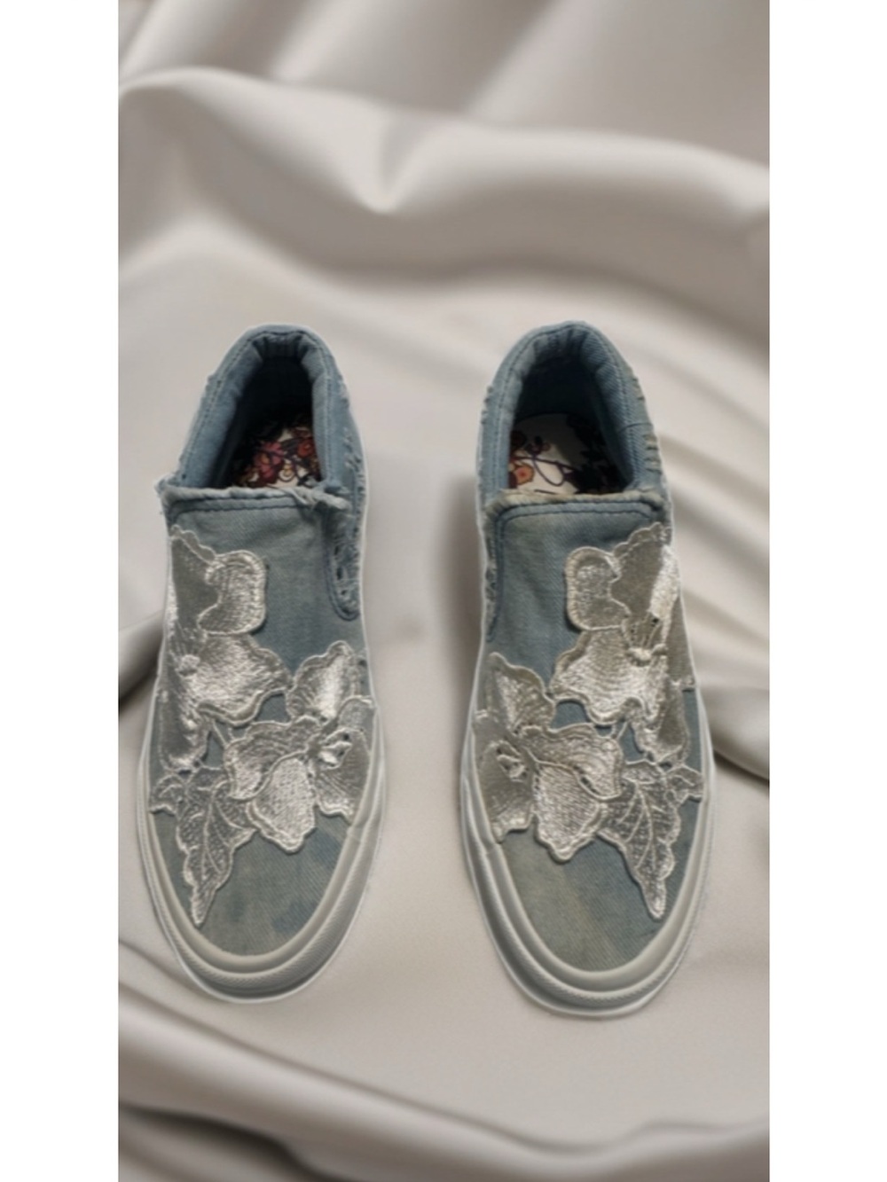 Blowfish Denim Slip-On Sneakers with White Floral Appliqué